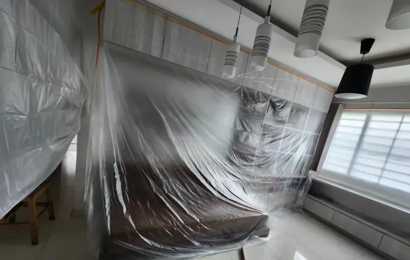 Room fully covered in protective plastic sheeting before works