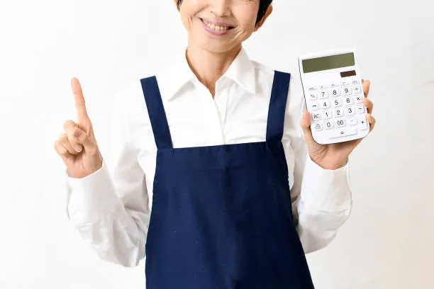Cleaner holding a calculator and raising a finger