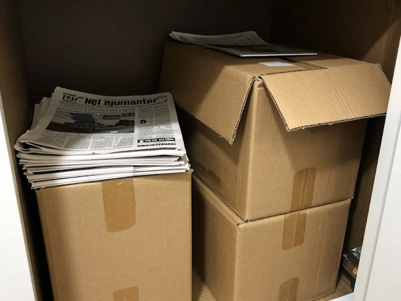 Stacked cardboard boxes and bundled newspapers