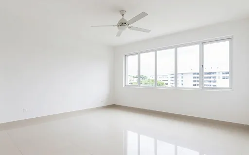 Empty room with a ceiling fan and polished floor