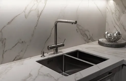 Marble kitchen counter with an undermount sink and tap